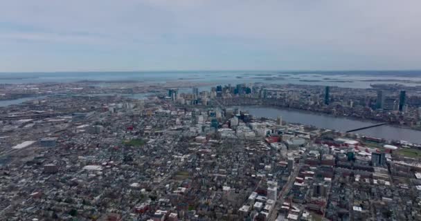 Amazing cinematic aerial panoramic footage of metropolis on sea side. Backwards reveal of buildings in residential borough, downtown skyscrapers and islands in background. Boston, USA — Vídeo de stock