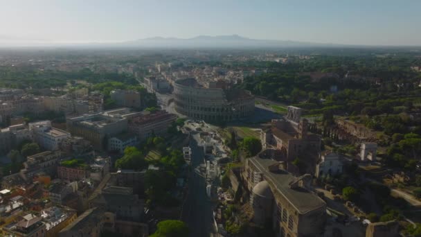 Historiska Turistattraktioner Mot Solen Flygfoto Panoramautsikt Över Antika Landmärken Colosseum — Stockvideo