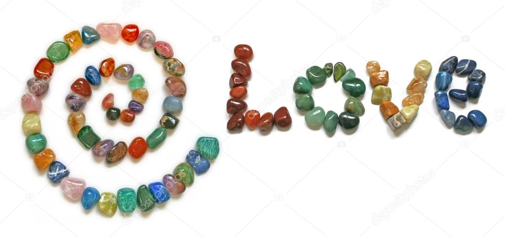 A Spiral and the word 'LOVE' formed from tumbled precious stones