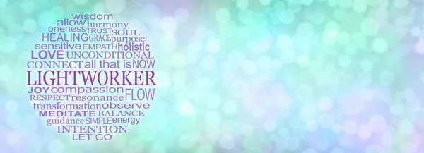 Lightworker word cloud message banner - circular tag cloud relevant to light work spiritual words against a pale green and purple bokeh wide background with copy space for messages