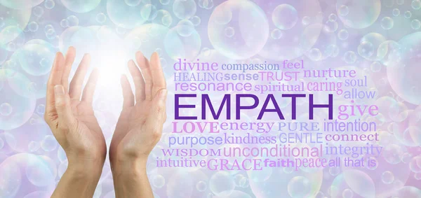 Words associated with Healing Empath spiritual concept - female cupped hands reaching upwards into white light against a pastel coloured bubble background and a word cloud relevant to EMPATH