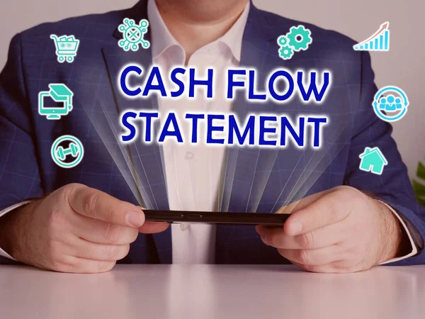 CASH FLOW STATEMENT phrase on the screen. Merchant use internet technologies at office. Concept search and CASH FLOW STATEMENT .