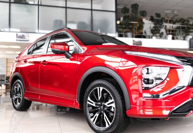 Vinnytsia, Ukraine - April 14, 2022: brand new Mitsubishi Eclipse Cross. Details. Close up of LED headlights, bumper, hood, radiator grille, taillights, side wings, mirrors. clipart