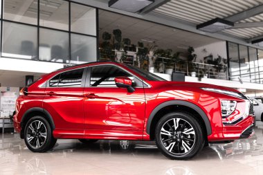 Vinnytsia, Ukraine - April 14, 2022: brand new Mitsubishi Eclipse Cross. Details. Close up of LED headlights, bumper, hood, radiator grille, taillights, side wings, mirrors. clipart