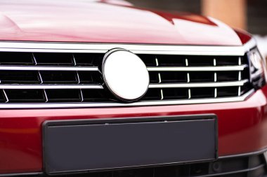 Close up detail on the red car taillight modern red crossover car. Exterior detail business automobile.