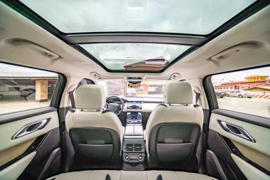 Car inside. Interior prestige modern car. Comfortable leather seats. Black cockpit with on isolated white background.