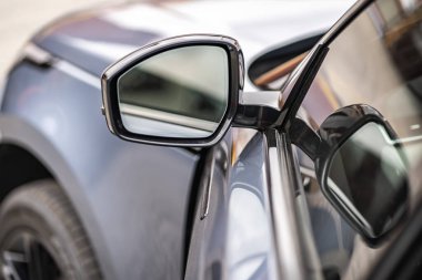 Side car mirror close-up. Details of the business car
