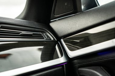 Car interior. Front handle door panel. Car open door window buttons