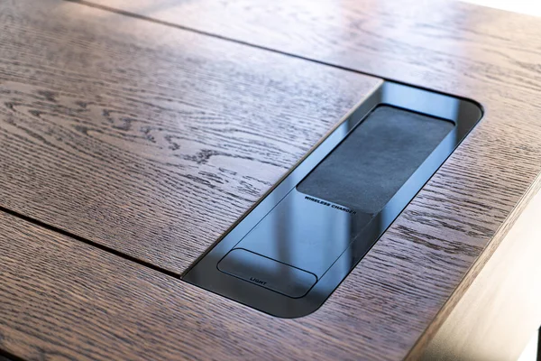 Mobile phone with wireless charger table. Modern workplace accessory