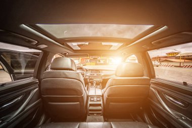 Car inside. Interior prestige modern car. Comfortable leather seats. Black cockpit with on isolated white background.