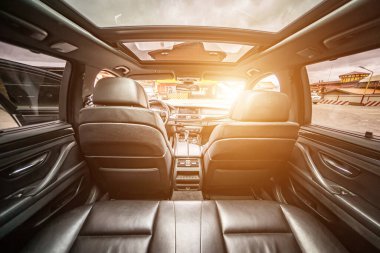 Car inside. Interior prestige modern car. Comfortable leather seats. Black cockpit with on isolated white background.