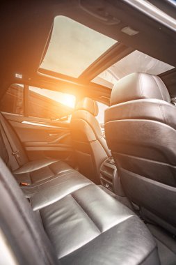 Car inside. Interior prestige modern car. Comfortable leather seats. Black cockpit with on isolated white background.
