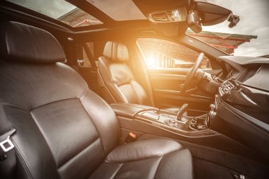 Car inside. Interior prestige modern car. Comfortable leather seats. Black cockpit with on isolated white background.