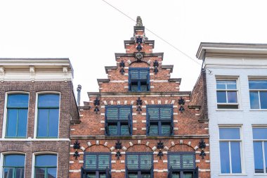 Haarlem, Hollanda - Mart 2022: Cozy Street view and generic architecture in Haarlem with tipik Hollanda style buildings.