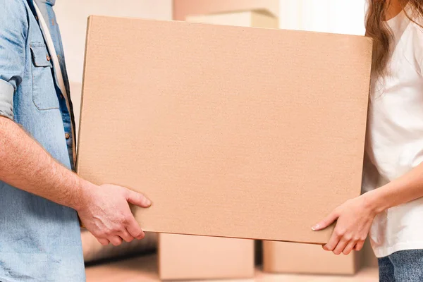 Man Woman Carry Cardboard Box Hands Moving New Home — Stock Photo, Image