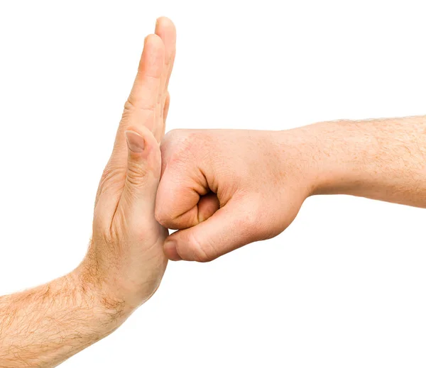 一只手紧握着拳头 在白色孤立的背景下碰到显示停止标志的手 免版税图库图片