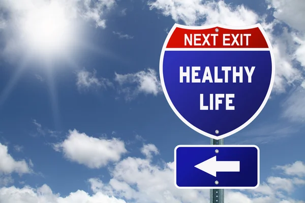 Red and blue interstate road sign Next Exit Healthy life — Stock Photo, Image