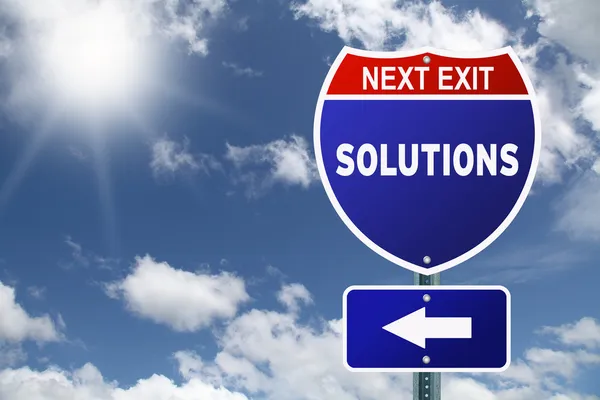 Next exit Solutions red and blue interstate road sign — Stock Photo, Image