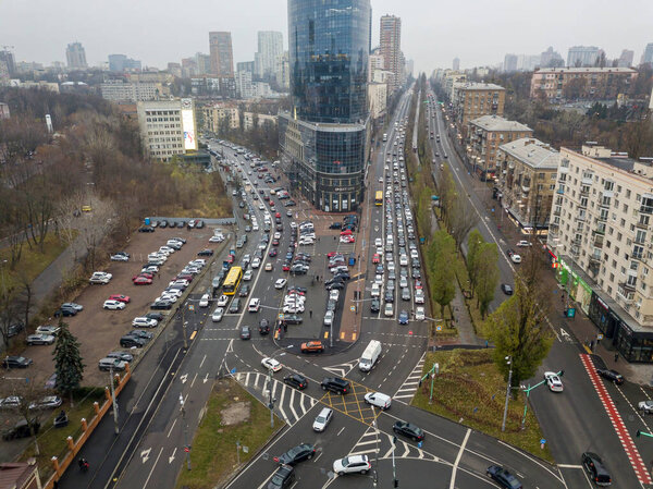 City street with a bike path in Kiev in cloudy weather. Aerial drone view.