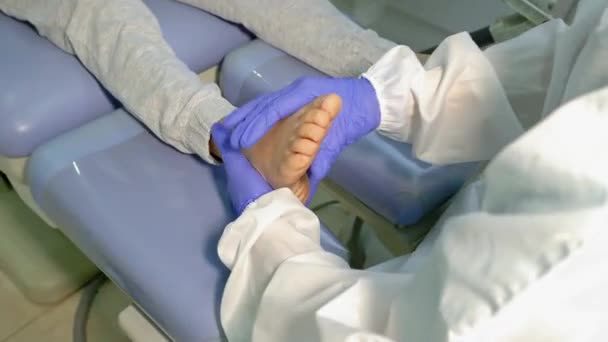 Woman Podologist Examining Patient Chiropody Treatment Selective Focus — Stock Video