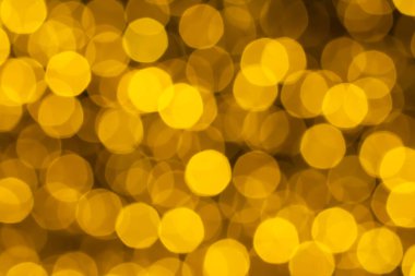 Bulanık bokeh altın ışıklar arka plan. Altın parıldayan yıldızlı tatil arkaplanı