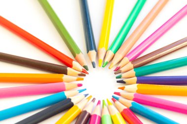 Set of multicolored rainbow pensils isolated on white background. Top view