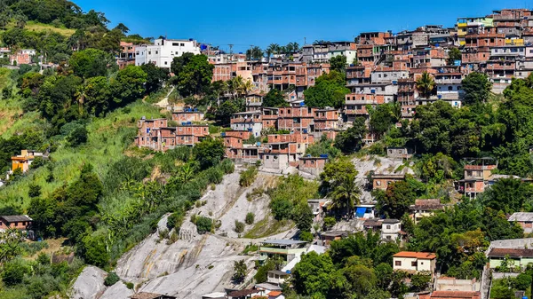 Communities known as favela are urban areas characterized by precarious housing and poor urban infrastructure. They are considered a consequence of the country\'s poor income distribution and housing deficit. Photo taken in Rio de Janeiro, Brazil.