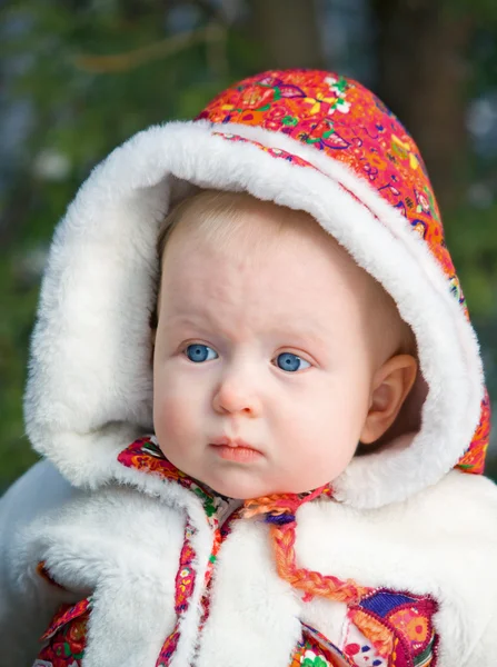 Closeup portrait of baby in fur coat — Stock Photo, Image