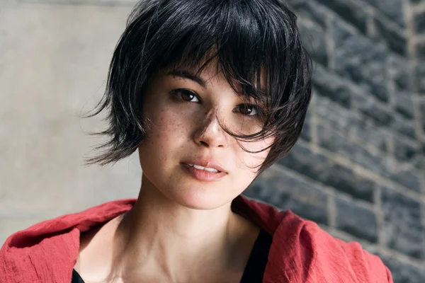 Japanese girl with short hair with freckles Stock Image