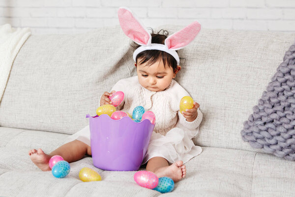 Cute Indian Baby Girl Pink Bunny Ears Basket Colorful Eggs Stock Picture
