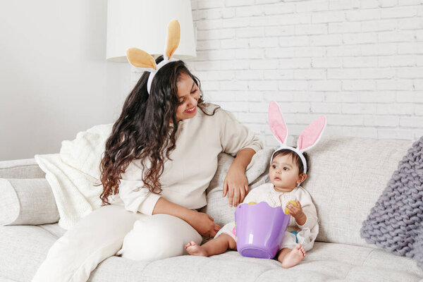 Indian Mother Baby Girl Daughter Bunny Ears Playing Toy Eggs Stock Image