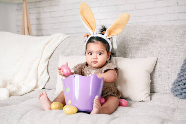 Cute Indian Baby Girl Pink Bunny Ears Basket Colorful Eggs Stock Picture