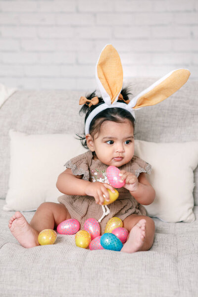 Cute Indian Baby Girl Pink Bunny Ears Playing Colorful Eggs Royalty Free Stock Photos