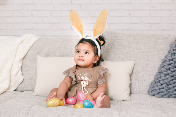 Cute Indian Baby Girl Pink Bunny Ears Playing Colorful Eggs Stock Picture