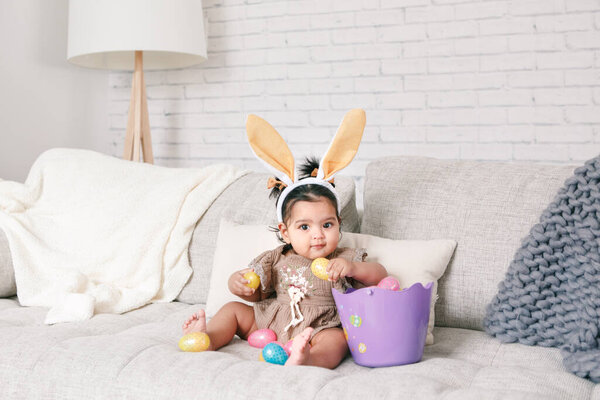 Cute Indian Baby Girl Pink Bunny Ears Basket Colorful Eggs Stock Picture