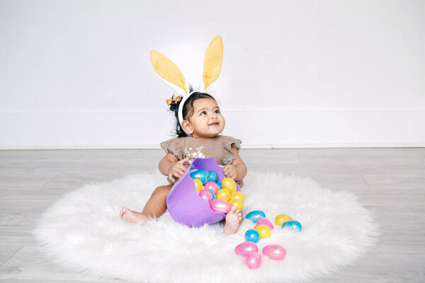 Cute Indian Baby Girl Pink Bunny Ears Basket Colorful Eggs Stock Picture