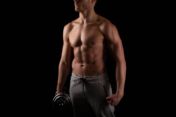 Man Showing ABS. Muscle man Posing with Dumbbell in Hand. Strong Body Concept. Topless Sport man Bodybuilder. Six Pack Spotsman — Stock Photo, Image