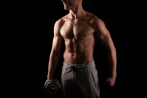 Man Showing ABS. Muscle man Posing with Dumbbell in Hand. Strong Body Concept. Topless Sport man Bodybuilder. Six Pack Spotsman — Stock Photo, Image