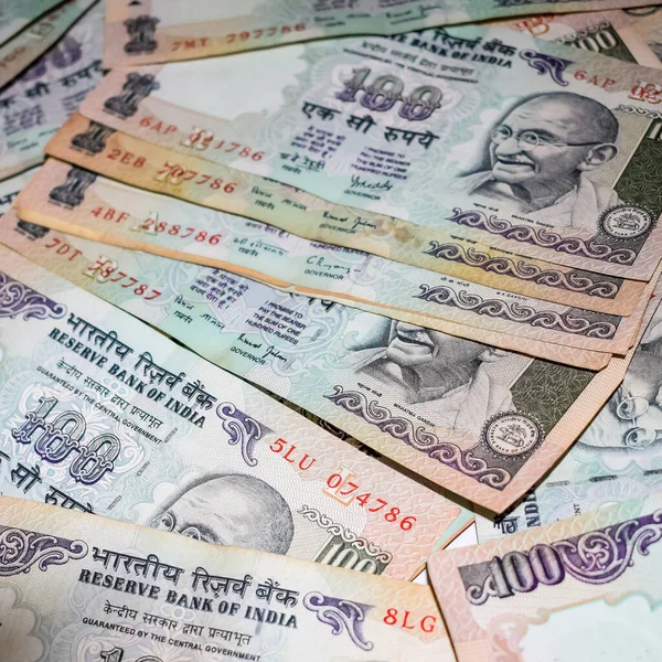 stock image Old One Hundred Rupee notes combined on the table, India money on the rotating table. Old Indian Currency notes on a rotating table, Indian Currency on the table