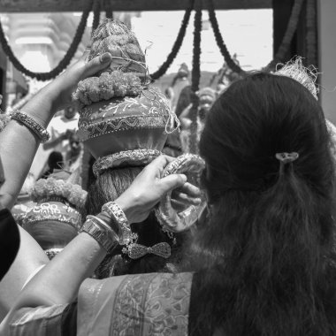 Women with Kalash on head during Jagannath Temple Mangal Kalash Yatra, Indian Hindu devotees carry earthen pots containing sacred water with coconut on top Black and White