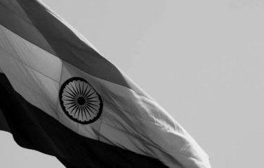 India flag flying high at Connaught Place with pride in blue sky, India flag fluttering, Indian Flag on Independence Day and Republic Day of India, tilt up shot, Waving Indian flag, Har Ghar Tiranga
