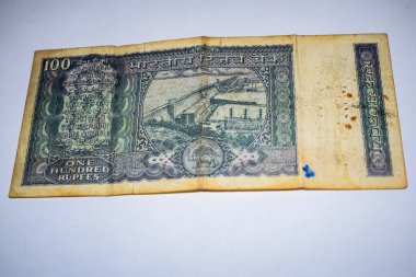 Rare Old One Hundred Rupee notes combined on the table, India money on the rotating table. Old Indian Currency notes on a rotating table, Indian Currency on the table
