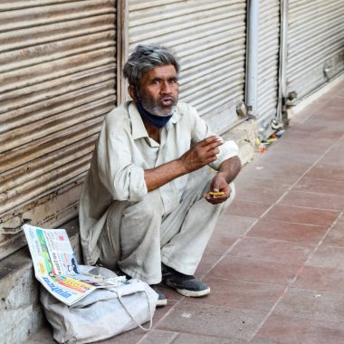 Old Delhi, India, April 15, 2022 - Unidentified group of men walking the streets of Old Delhi, Street Photography of Chandni Chowk market of Old Delhi during morning time, Old Delhi Street Photography