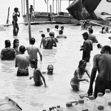 Garh Mukteshwar, UP, India, June 11 2022 -People are taking holy dip on the occasion of Nirjala Ekadashi, A view of Garh Ganga Brij ghat which is very famous religious place for Hindus-Black and White
