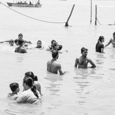 Garh Mukteshwar, UP, India, June 11 2022 -People are taking holy dip on the occasion of Nirjala Ekadashi, A view of Garh Ganga Brij ghat which is very famous religious place for Hindus-Black and White