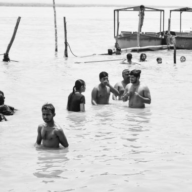 Garh Mukteshwar, UP, India, June 11 2022 -People are taking holy dip on the occasion of Nirjala Ekadashi, A view of Garh Ganga Brij ghat which is very famous religious place for Hindus-Black and White