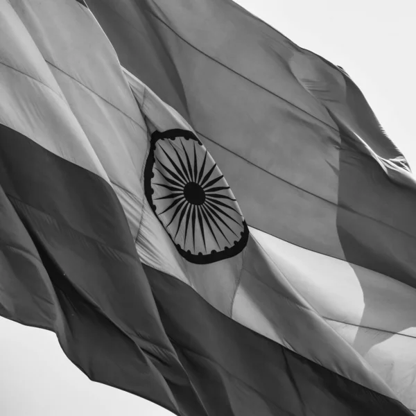 India flag flying at Connaught Place with pride in blue sky, India flag fluttering, Indian Flag on Independence Day and Republic Day of India, waving Indian flag, Flying India flags - Black and White
