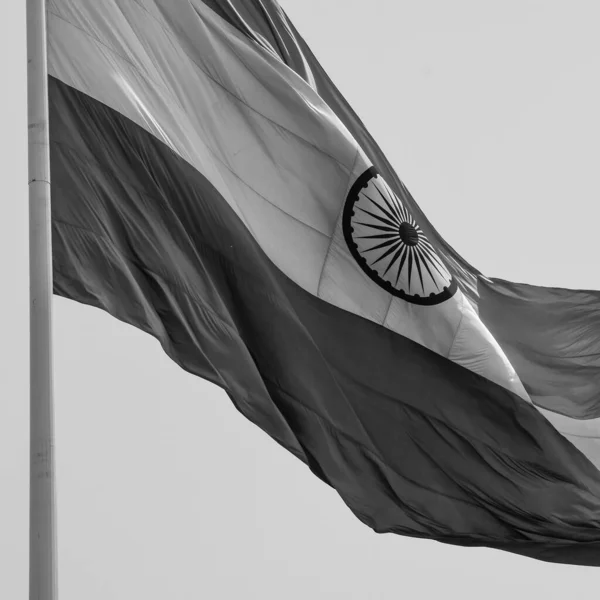 India flag flying at Connaught Place with pride in blue sky, India flag fluttering, Indian Flag on Independence Day and Republic Day of India, waving Indian flag, Flying India flags - Black and White