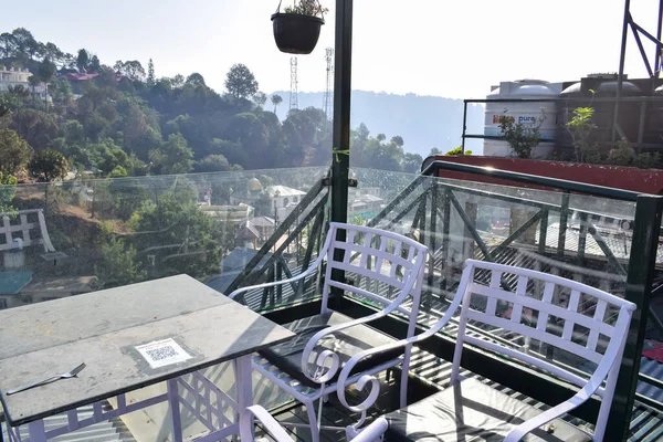 Early morning view of Modern rooftop restaurant at Kasauli, Himachal Pradesh in India, View of mountain hills from open air restaurant in Kasauli, Kasauli Rooftop restaurant