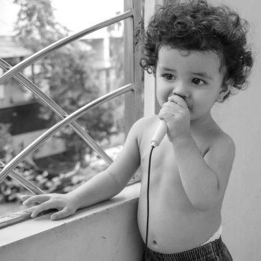 Cute little boy Shivaay sapra at home balcony during summer time, Sweet little boy photoshoot during day light, Little boy enjoying at home during photo shoot Black and White